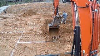 Digging footings on a new house in Auburn Alabama (Kubota KX057)