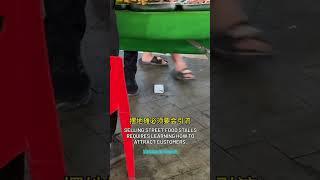 Next Level Marketing Street Food Vendor Has An iPhone Glued To The Ground To Attract Customers!