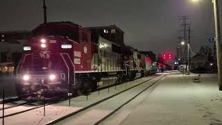 Repainted WSOR SD60M pair leads T001 at Morton Grove with horn