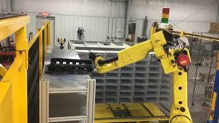 Automated Fanuc cell with 2D laser marking, short shot detection, and packing with laser assist.