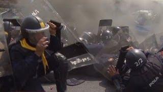 Thai police and protesters exchange gunfire