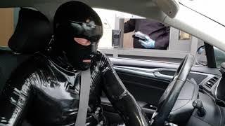 In public getting a McDonalds Drive thru in latex.