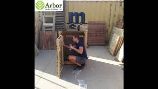 Single bay wooden log store - reverse roof