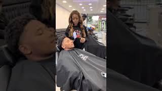 Prank kiss at men's barber shop