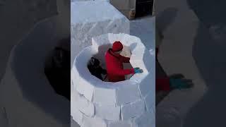 Building a snow house from snow bricks