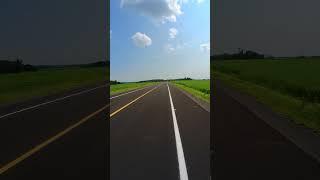 Me, my bike, blue sky, white clouds, green fields, black pavement. It does not get better than this.