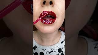 Magical red lipstick painting a lip art?