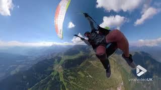 Paraglider 'stands' on top of another daredevil's parachute || Viral Video UK