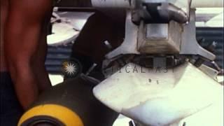 US Marines attach bombs to a F-4B Phantom II airplane at Chu Lai in Vietnam HD Stock Footage