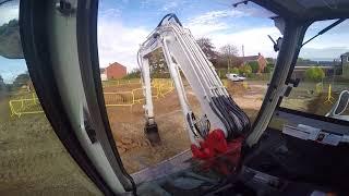 Takeuchi TB290 excavator digging out a trench