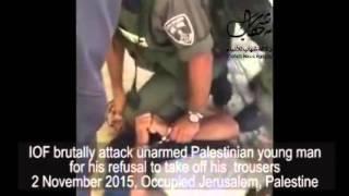 Israeli soldiers forcing an Arab man to undress in public by beating him.