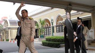 Thai PM leaves cardboard cutout to take questions from the media