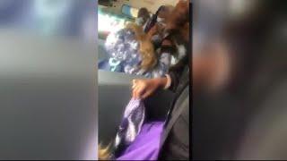 Video shows woman restrain small child, sit on him in school bus struggle