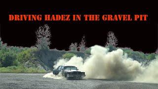 driving the rat rod Cadillac in the gravel pit