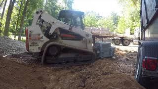 Bobcat and excavator grading, retaining wall installation and paver patio install in Marietta, GA