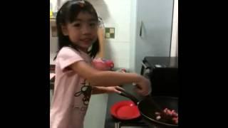 Jeslyn cooking at 5 years old