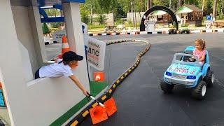Milana and NIka play with car on playground for Kids.