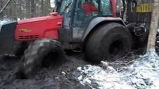 Valtra forestry tractor  in deep mud