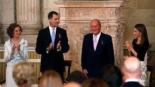 King Juan Carlos signs into law his abdication