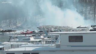 Boats sink after a massive fire at the marina on Patoka Lake in Indiana