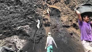 mining sand..!!! excavation of thick, black mountain walls