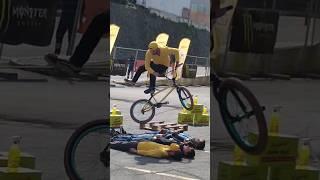 Defying Gravity: A Cyclist's Daring Jumps Over a Human Obstacle Course