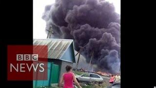 MH17: New footage shows crash aftermath - BBC