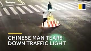 Chinese man tears down traffic light after waiting for two minutes