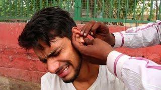 Roadside Ear wax cleaner : Painful way to remove dirt and gunk with a needle ??