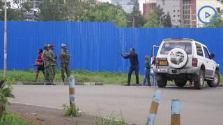 Jeff Koinange shares a laugh with police officers barricading Milimani courthouse