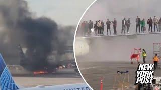 American Airlines plane catches fire at Denver Int'l Airport, passengers forced to stand on wing