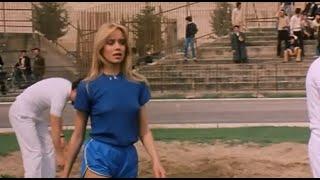 The Beautiful *Gloria Guida* In Blue Shiny Shorts At School Sports