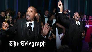 Will Smith smiles and dances at Oscars afterparty after slapping Chris Rock