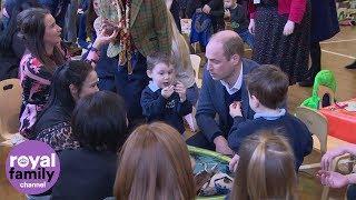 Duke of Cambridge and children play with dinosaurs