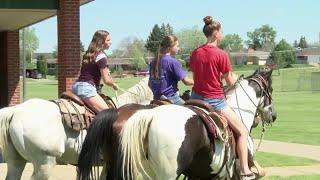 East Middle School students ride horses to school