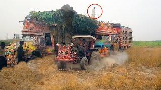 Tractor pulling Truck stuck in sand/Pulling with massey ferguson 385 & mf 375