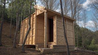 Construction from Pallets. Free wood. House in the Forest