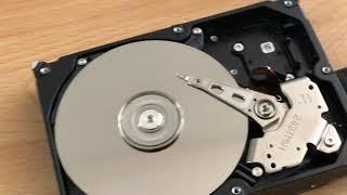 How does a hard drive sounds without a cover? ... not good.