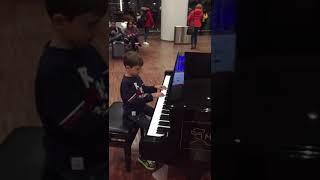 Airport Orio al Serio Bergamo, Mattia  at the piano waiting to leave #yamahapiano #aeroportobergamo