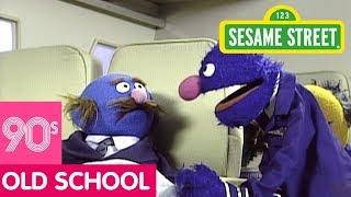 Sesame Street: Grover the Flight Attendant Looks for Something to Read