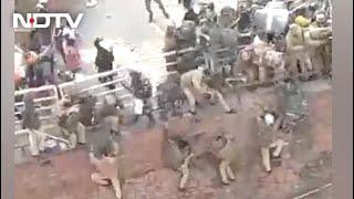 In Shocking Video, Delhi Cops Forced To Jump Off Wall To Escape Farmers At Red Fort