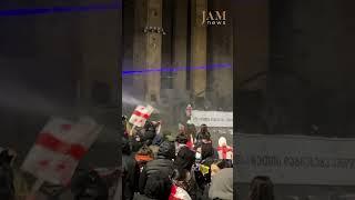 Protesters gathered near parliament are doused with water/ Tbilisi, Georgia/JAMnews English