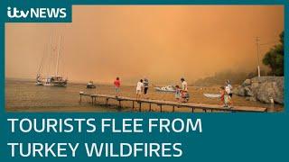 Turkey: Wildfire death toll rises to 8 as blaze threatens tourist resorts | ITV News