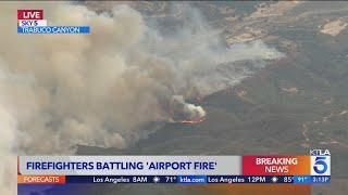 Large wildfire erupts in Orange County