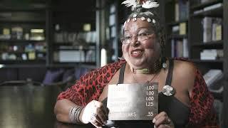 Victoria Cruz with the bar sign from the Stonewall Inn