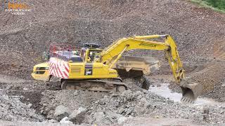 Komatsu PC360LC excavating rock on a road project