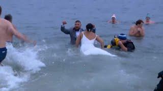 Newlyweds take New Year's Day polar plunge with L Street Brownies