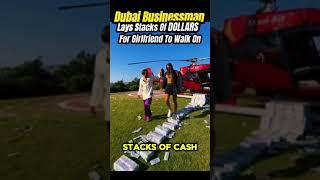 Dubai businessman lays stacks of money for girlfriend to walk on, video goes viral