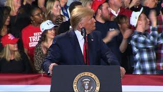 Trump: "Get her out" as protester interrupts rally