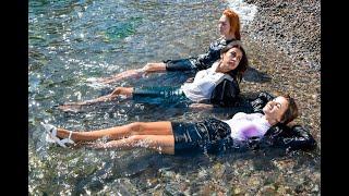 three girls after work in the office pose in wet clothes for wetlook